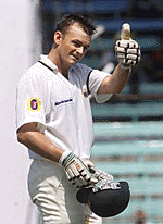 Australia's Adam Gilchrist gives the thumbs up sign to the Australian dressing room
