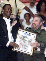 Cuban President Fidel Castro presents a diploma to Cuba's most outstanding sportsman of the millennium