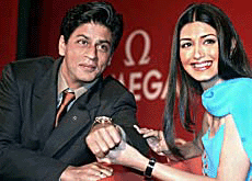 Shahrukh Khan and Sonali Bendre display a watch at the launch of Omegas new De Ville Co-Axial collection in New Delhi on Sunday.
