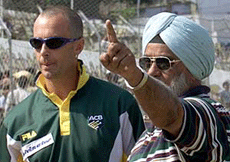 Australian off spinner Colin Miller (L) receives tips from former Indian spin wizard Bishan Singh Bedi at New Delhi's cricket ground on Wednesday.