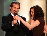 Actress Julia Roberts smiles as she accepts an award from Jeff Bridges at the 7th annual Screen Actors Guild Awards ceremony on Sunday at the Shrine Auditorium in Los Angeles. 
