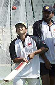 India batsman Sachin Tendulkar (L) practices while being watched by bowler Javagal Srinath on the eve of the third and final Test between India and Australia in Chennai on Saturday. 