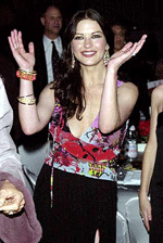Actress Catherine-Zeta Jones dances to the music of Salsa singer Marc Anthony at Jaguars Tribute to Style Gala at Santa Monica, California, on Sunday.