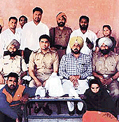 The Dehlon police party with the opium smugglers appreh - ended near Kila Raipur on Sunday. 