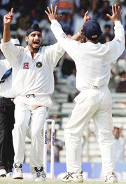 Harbhajan Singh celebrates after taking his fifth wicket