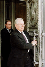US ambassador James Collins (right) leaves Russias Foreign Ministry building in Moscow on Thursday. 