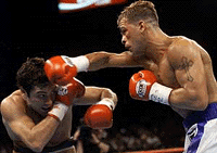 Oscar De La Hoya (left) of Los Angeles ducks a punch by Arturo Gatti of Montreal