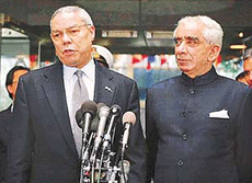 External Affairs Minister Jaswant Singh looks on as Secretary of State Colin Powell answers a reporters question outside the State Department in Washington on Friday.