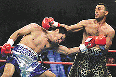 Marco Antonio Barrera (L) of Mexico City and Prince Naseem Hamed of Sheffield, England, in action in the fourth round of their featherweight fight at the MGM Grand Garden Arena in Las Vegas on Saturday.