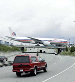 EVERETT, USA : A new American Airlines jet is towed across an access bridge at the Boeing company's commercial aircraft plant in Everett, Wash., Wednesday, April 4, 2001.