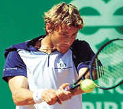 Spains Juan Carlos Ferrero returns the ball to his compatriot Albert Portas during the semifinal of the Estoril Tennis Open held in Jamor Sports Centre on Saturday. Juan Carlos Ferrero beat Portas 6-3,6-1. 
