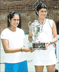 Rushmi Chakarvorty (right) and Sai Jayalakshamy of India with the doubles trophy at the ITF Women's Tennis Tournament in Chandigarh, on Friday.
