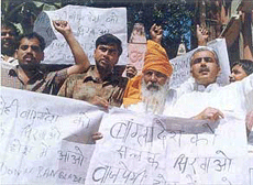 Activists of the Rashtriya Chetna Sangh demonstrate in New Delhi on Sunday against the brutal torture and killing of 16 BSF soldiers by the Bangladesh Rifles.