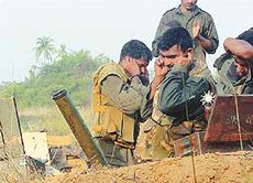 Sri Lankan soldiers fire a mortar during the military offensive against Tamil Tiger rebels in nothern Jaffna peninsula Sri Lanka on Wednesday.