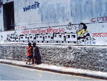 A CPM graffiti depicts Trinamool Congress Chief Mamata Banerjee taking leave from politics after the elections and retiring to Kashi.