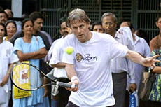 Tennis enthusiasts watch Bjorn Borg play a shot during an exhibition match in Mumbai on Thursday.