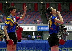 South Korean pair Kim Moo-Kyo (right) and Oh Sang-eun react after winning their mixed doubles semifinal at the 46th World Table Tennis Championships at Osaka, western Japan, on Friday.