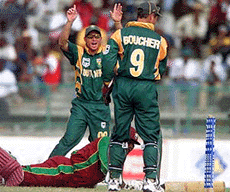 West Indies captain Carl Hooper lies on the ground after he was run out by South African wicketkeeper Mark Boucher, during the third Cable and Wireless one Day International match at the Queen's Park Stadium in St. George's, Grenada, on Saturday. 