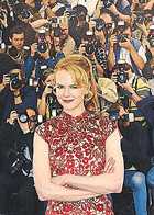 Australian actress Nicole Kidman strikes a pose in front of a wall of photographers during a photo call for the film Moulin Rouge by Australian director Baz Luhrmann at the 54th International Film Festival in Cannes, on Wednesday.