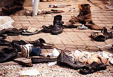Footwear left behind by those trying to escape the stampede at the Accra stadium is seen on Thursday. Ghanas government has announced a three-day mourning period, and the police have sealed off Accras main stadium following a stampede during a soccer match in the Accra Stadium on Wednesday. 