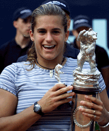 Amelie Mauresmo from France holds her trophy on Sunday, after winning the final match of the German Open in Berlin.