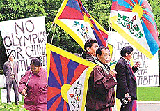 Tibetan exiles demonstrate against Beijings bid for the 2008 Olympics outside the International Olympic Committees (IOC) headquarters on Tuesday in Lausanne. 