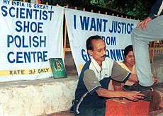 West Bengal scientist Debojyoti Bandhopadhayay along with his wife Mita polishing shoes in protest against the injustice meted out him at Jantar Mantar in New Delhi on Saturday.