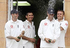 England's (L-R) Michael Vaughn, Andy Caddick, Marcus Trescothick and Dominic Cork celebrate with champagne after defeating Pakistan in the first Test at Lord's on Sunday. 