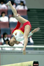 Qi Linzi of China performs on the balance beam during the women's team event final of the 3rd East Asian Games in Osaka, western Japan on Monday.