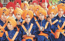 Children take part in a procession held in connection with Martyrdom Day of Guru Arjan Dev in Chandigarh on Tuesday.