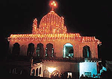 Tastefully decorated Roza Sharif at Fategharh Sahib attracts devotees on the occasion of annual Urs on Tuesday night.