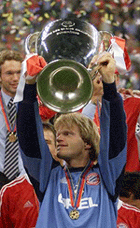Bayern Munich's goalkeeper Oliver Kahn lifts the European Cup in the San Siro Stadium in Milan on Wednesday.