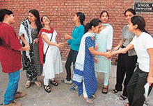 Girls congratulate each other for their superlative performance in Class XII examinations, in Government Model Senior Secondary School, Sector 35, Chandigarh, on Friday.