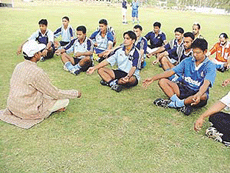 Yogacharya Sanjay Solanki in a yoga session with members of the Indian hockey team on the ground of Punjab Agricultural University, Ludhiana.