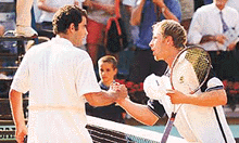 Pete Sampras (L) of the USA shakes hand with Cedric Kauffmann of France after their match at Roland Garros stadium on Tuesday. 