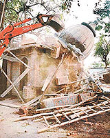 A JCB pulls down a newly constructed temple on MC land in Sector 35, Chandigarh.
