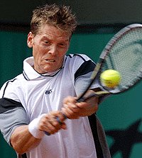 Thomas Enqvist of Sweden returns the ball during his match against Jose Acasuso of Argentina at the French Open at Roland Garros stadium on Wednesday.
