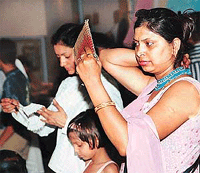 A visitor tries an item at an exhibition in Panchayat Bhavan, Chandigarh, on Friday.