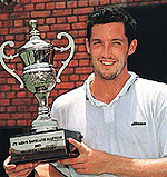 John Doran (4th seed) of Ireland, the winner of mens singles event of ITF Mens Satellite Masters 2001 with trophy in Chandigarh on Friday.