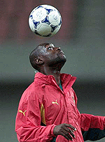 Cameroon national team striker Patrick Mboma heads the ball during a training session at the Big Swan Stadium in Niigata, about 320 km (200 miles) north of Tokyo on Friday.