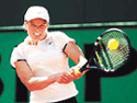Kim Clijsters of Belgium returns to Marta Marrero of Spain in their womens singles match at the French Tennis Open at Roland Garros stadium on Friday.