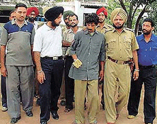 The alleged conman, Zuber Ahmed, a resident of Gurgaon in Haryana, arrested in a raid at a house in Haibowal.