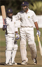 Shiv Sunder Das (L) is congratulated by fellow batsman Venkatsai Laxman after scoring his century on Saturday.