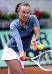 Top-seeded Martina Hingis of Switzerland returns a backhand to Australia's Rachel McQuillan at the French Tennis Open at Roland Garros stadium on Saturday.