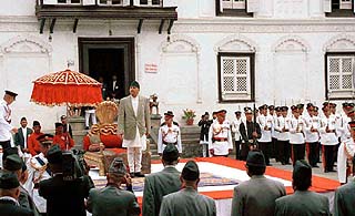 Nepal's Prince Gyanendra poses for pictures early on Monday.