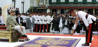 A General pays respect to Nepal's new King Gyanendra.