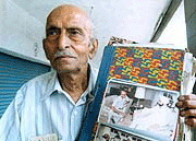 Mr. S.S Uppal chairman of the galiara grievances committee exhibits photograph with late president Ggiani Jail Singh to whom he appealed for suitable rehabilitation.