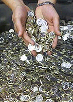 Fresh minted euro coins stored in a box at the Bavarian state mint in Munich, on Tuesday.