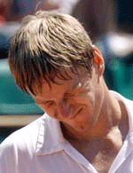 Yevgeny Kafelnikov of Russia reacts during his quarterfinal of the French Open against Gustavo Kuerten of Brazil at Roland Garros on Tuesday. 