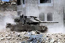 An Israeli tank takes up position near an Israeli checkpoint in the West Bank city of Ramallah on Wednesday.